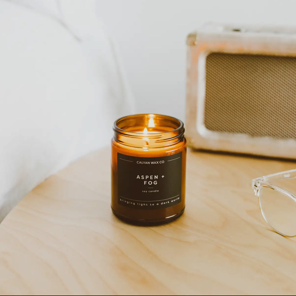 
                      
                        Aspen + Fog Candle in Amber Glass
                      
                    