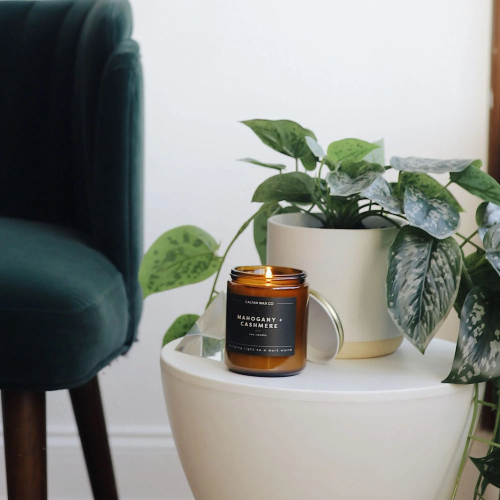 
                      
                        Mahogany + Cashmere Candle in Amber Glass
                      
                    